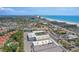 Expansive aerial view showcases the property near the beach with stunning ocean views and close proximity to local attractions at 121 46Th Ave # 2H, St Pete Beach, FL 33706