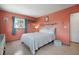 Bright bedroom with three windows, terrazzo flooring, and floating shelves at 121 46Th Ave # 2H, St Pete Beach, FL 33706