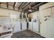 Shared laundry room with multiple washers and dryers, offering convenience at 121 46Th Ave # 2H, St Pete Beach, FL 33706
