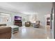 Cozy living room with comfortable furnishings, a TV, and a view of the exterior, creating a welcoming space at 121 46Th Ave # 2H, St Pete Beach, FL 33706