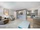 Inviting living room with an open floor plan leading to the kitchen and dining area, perfect for entertaining guests at 121 46Th Ave # 2H, St Pete Beach, FL 33706