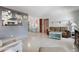 Bright living room with an open layout, seamlessly connecting to the dining area and kitchen for easy living at 121 46Th Ave # 2H, St Pete Beach, FL 33706