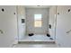 Spacious marble tiled bathroom with a window. Under construction at 1405 50Th N Ave, St Petersburg, FL 33703