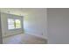 Minimalist bedroom with light hardwood floors and window providing great natural light at 1405 50Th N Ave, St Petersburg, FL 33703