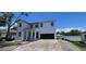 Elegant two-story home with a modern design, showcasing a welcoming entrance and attached garage at 1405 50Th N Ave, St Petersburg, FL 33703