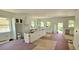 Spacious kitchen featuring a large center island, modern range hood, and lots of windows. Under construction at 1405 50Th N Ave, St Petersburg, FL 33703