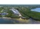 Scenic aerial view of coastal townhomes nestled amidst lush mangroves and waterfront at 1500 Sunset Rd # G4, Tarpon Springs, FL 34689