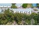 An aerial shot showcasing the neighborhood's architecture amidst lush greenery and beautiful tree coverage at 1500 Sunset Rd # G4, Tarpon Springs, FL 34689