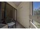 Balcony featuring a chair and view of surrounding trees at 1500 Sunset Rd # G4, Tarpon Springs, FL 34689