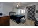 Well-appointed bedroom with window desk area and dark blue comforter set at 1500 Sunset Rd # G4, Tarpon Springs, FL 34689