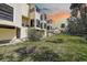 A three-story home with a large grassy yard at 1500 Sunset Rd # G4, Tarpon Springs, FL 34689
