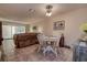 Inviting living room featuring tile floors and a comfortable seating arrangement near the dining area at 1500 Sunset Rd # G4, Tarpon Springs, FL 34689