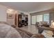 Comfortable living room with large sliding glass doors to the patio at 1500 Sunset Rd # G4, Tarpon Springs, FL 34689