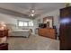 Spacious main bedroom featuring large dresser, ceiling fan, and good natural light at 1500 Sunset Rd # G4, Tarpon Springs, FL 34689
