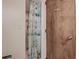The bathroom features a shower with seashell-themed curtain and white tile at 1500 Sunset Rd # G4, Tarpon Springs, FL 34689