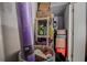 A cluttered storage area with a variety of household items, including cleaning supplies and boxes at 1500 Sunset Rd # G4, Tarpon Springs, FL 34689