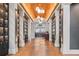 Elegant Barrel House featuring lockers, a stylish bar area, and warm, inviting lighting at 15635 Sacile Ln, Bradenton, FL 34211