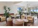 Stylish clubhouse lounge area with modern fireplace, comfortable seating and TV at 15635 Sacile Ln, Bradenton, FL 34211