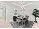 Dining room features recessed lights, modern light fixture, and light colored wood flooring at 15635 Sacile Ln, Bradenton, FL 34211