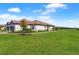 Charming single-story home with well-manicured lawn, mature landscaping, and a paved driveway at 15635 Sacile Ln, Bradenton, FL 34211