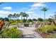 Outdoor firepit area with comfortable seating surrounded by landscaping at 15635 Sacile Ln, Bradenton, FL 34211