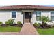 Charming front entrance featuring manicured landscaping and a brick walkway at 15635 Sacile Ln, Bradenton, FL 34211
