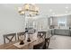 Open floor plan with eat-in kitchen and view of living room with access to front entry at 15635 Sacile Ln, Bradenton, FL 34211