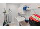 Functional laundry room with washer, dryer, storage, and organizing accessories at 15635 Sacile Ln, Bradenton, FL 34211