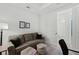 Living room features recessed lights, a loveseat, and a bathroom with standing shower at 15635 Sacile Ln, Bradenton, FL 34211