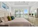 Main bedroom with view of lake, neutral decor, and large window at 15635 Sacile Ln, Bradenton, FL 34211