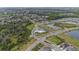 Aerial view of homes with community pool and amenities at 18184 Turning Leaf Cir, Land O Lakes, FL 34638