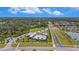 Aerial view of community amenities, including pool and playground, nestled among lush landscaping and homes at 18184 Turning Leaf Cir, Land O Lakes, FL 34638