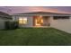 Private backyard with well-maintained lawn, patio and partial fence, perfect for outdoor activities at 18184 Turning Leaf Cir, Land O Lakes, FL 34638