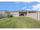 Spacious backyard with lush green lawn and a patio perfect for entertaining at 18184 Turning Leaf Cir, Land O Lakes, FL 34638