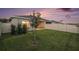 Private backyard with well-maintained lawn, patio and partial fence, perfect for outdoor activities at 18184 Turning Leaf Cir, Land O Lakes, FL 34638