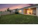 Private backyard with well-maintained lawn, patio and partial fence, perfect for outdoor activities at 18184 Turning Leaf Cir, Land O Lakes, FL 34638