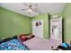 bedroom with car-shaped beds, a ceiling fan, and a closet for storage at 18184 Turning Leaf Cir, Land O Lakes, FL 34638