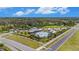 Aerial view of community pool and recreation center surrounded by manicured landscaping at 18184 Turning Leaf Cir, Land O Lakes, FL 34638