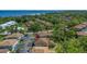 Aerial view of community with lush green landscaping, a swimming pool, and easy access to the waterfront at 1830 Bough Ave # 2, Clearwater, FL 33760