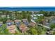 Aerial view of community with lush landscaping, a community pool, and proximity to the waterfront at 1830 Bough Ave # 2, Clearwater, FL 33760