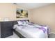 Serene bedroom featuring a comfortable bed and decorative wall art at 1830 Bough Ave # 2, Clearwater, FL 33760