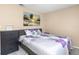 Well-lit bedroom with a queen size bed and decorative floral bedding at 1830 Bough Ave # 2, Clearwater, FL 33760