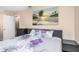Comfortable bedroom featuring a bed and decorative wall art at 1830 Bough Ave # 2, Clearwater, FL 33760