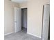 Neutral bedroom featuring tiled floors and a closet at 1830 Bough Ave # 2, Clearwater, FL 33760