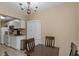 Dining area with tiled floor and natural light looks into the kitchen at 1830 Bough Ave # 2, Clearwater, FL 33760