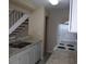 Efficient kitchen featuring stainless steel sink, white cabinetry, and modern appliances at 1830 Bough Ave # 2, Clearwater, FL 33760