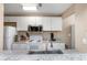 Well-equipped kitchen featuring white appliances, granite countertops, and ample cabinet space at 1830 Bough Ave # 2, Clearwater, FL 33760