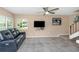 Inviting living room featuring a plush leather sofa and large windows at 1830 Bough Ave # 2, Clearwater, FL 33760