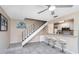 Comfortable living room with tiled floors, a breakfast bar, and adjacent kitchen area at 1830 Bough Ave # 2, Clearwater, FL 33760