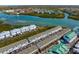 Gorgeous aerial perspective of the property, near waterfront, pool and lush landscaping at 19823 Gulf Blvd # 33, Indian Shores, FL 33785